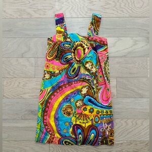 Milly dress with snap bow and zipper closure on back. Side pockets. Oversized